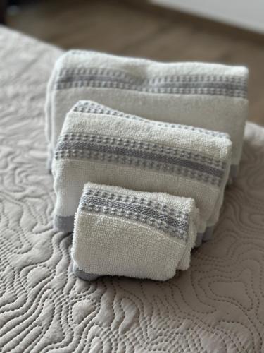 two towels sitting on top of a bed at FronteMare in Ladispoli