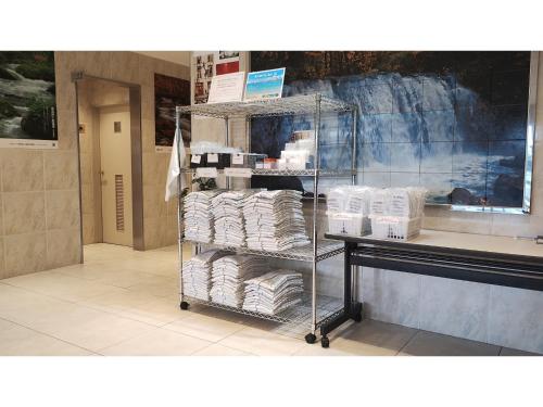 a store with a rack of towels in a store at Smile Hotel Towada - Vacation STAY 06152v in Towada