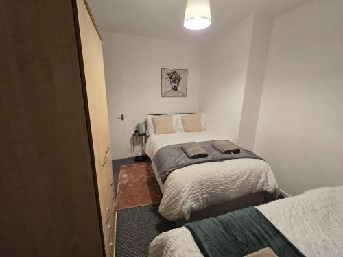 a small room with two beds in it at Room 2 shared house 5 minutes from Anfield in Liverpool