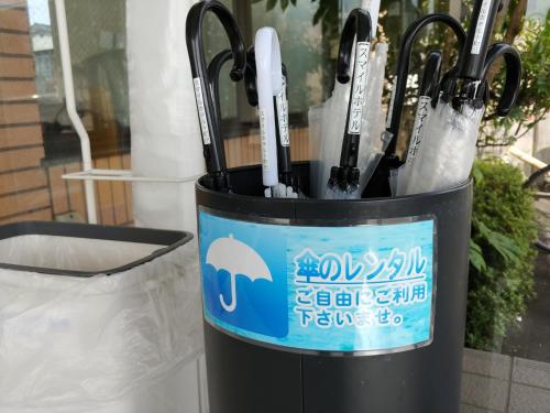 a trash can with pens in it with a sign at Smile Hotel Towada - Vacation STAY 06145v in Towada