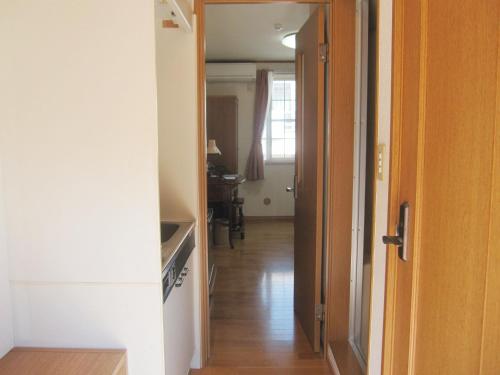 a hallway with a door open to a room at Hotel Pacific - Vacation STAY 07373v in Ishinomaki