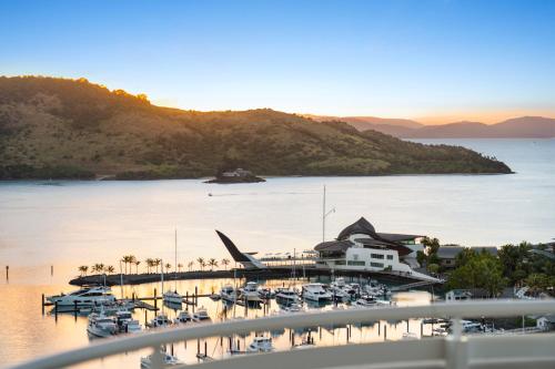 a view of a marina with boats in the water at Luxury Hamilton Island Sub Penthouse on Level 12 & Buggy & Transfers in Hamilton Island