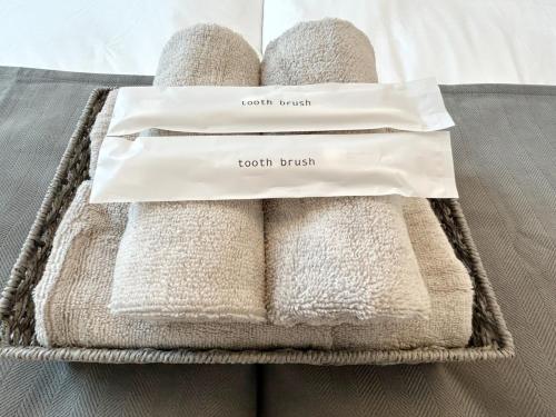 two towels in a basket on a bed at NAGOMI - Vacation STAY 16320v in Yamatokoriyama