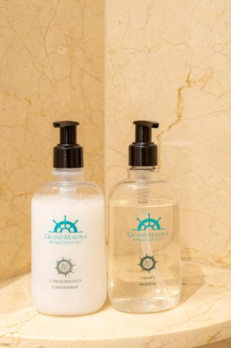two bottles of soap sitting on a counter at Grand Marina Suites Santa Marta in Santa Marta