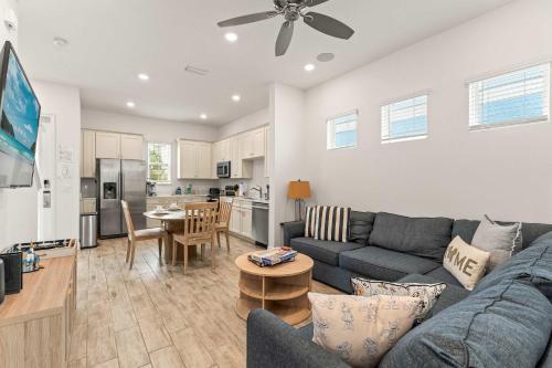 a living room with a couch and a table at The Flamingo Nest - Kid Friendly in Orlando