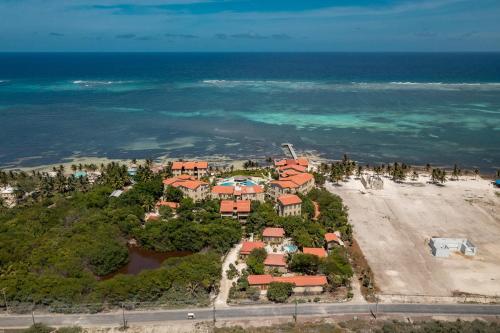 an aerial view of a resort near the ocean at Residences at Barrier Reef Casita 3 by Stay Floreo in San Pedro Island