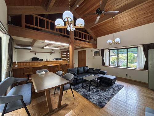 a living room with a couch and a table at ChillOut MINAMIASO - Vacation STAY 25172v in Minami Aso