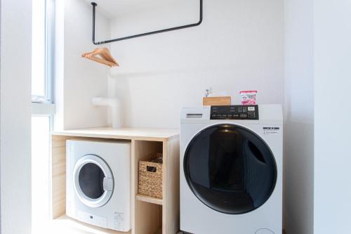 a laundry room with a dryer and a washing machine at CAN LI ASSO - Vacation STAY 25193v in Minami Aso