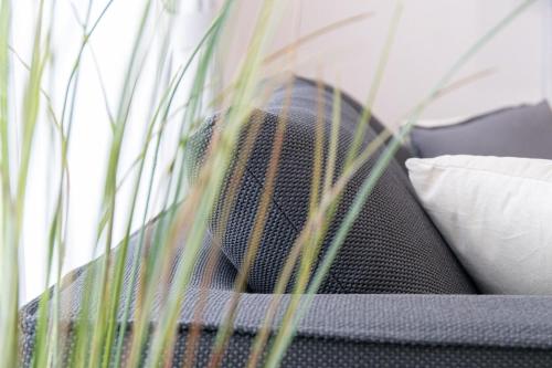 a person sitting on a couch with a pillow at CAN LI ASSO - Vacation STAY 25225v in Minami Aso