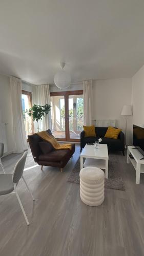a living room with a couch and a table at AirStay Orly T3 - Aéroport 10 min - Paris 20 min - Disney 30 min - Rungis in Orly