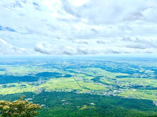 an aerial view of a city with trees and clouds at Sirius AMA - Vacation STAY 20068 in Tsukuba
