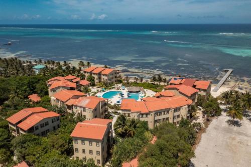 an aerial view of a resort on the beach at Residences at Barrier Reef 1-3B Oceanfront 2 BR by Stay Floreo in San Pedro Island