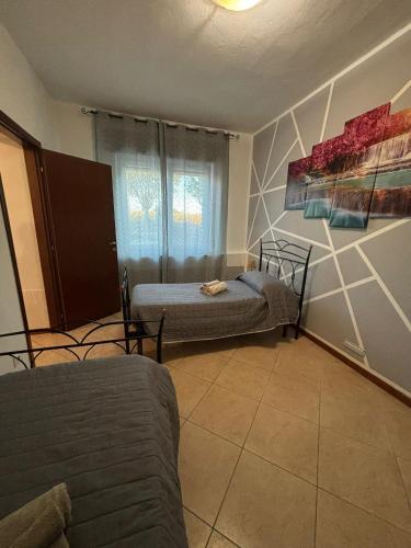 a living room with two beds and a couch at Casa Domus Oppiorum in Ca degli Oppi
