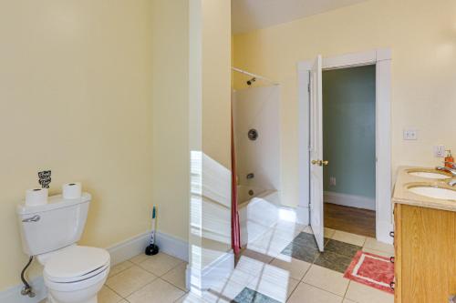 a bathroom with a toilet and a sink and a shower at 5,000 Sq Ft Antebellum Farmhouse 3 Mi to Antietam! in Fairplay