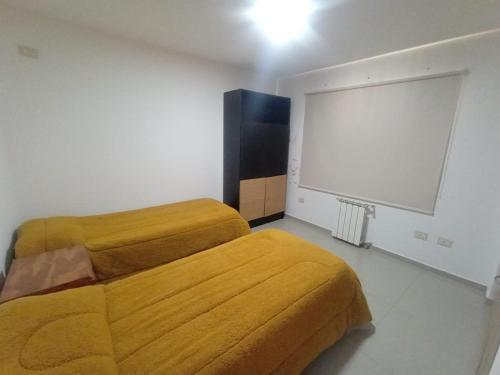 Postel nebo postele na pokoji v ubytování Confortable Casa en Pilar Rio II