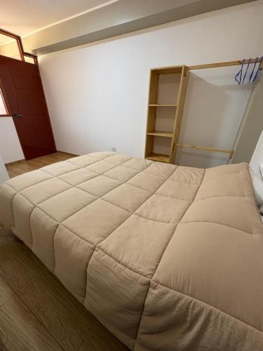 a bedroom with a large bed in a room at Apus Guest House in Huaraz