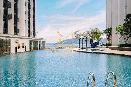 Πισίνα στο ή κοντά στο Maxhome at The Shore Kota Kinabalu