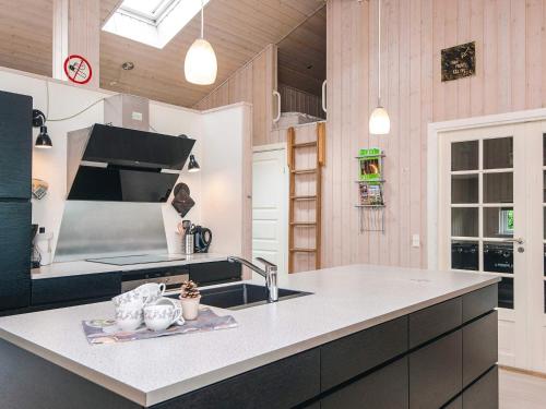 a kitchen with a sink and a counter at 10 person holiday home in Ansager-By Traum in Ansager