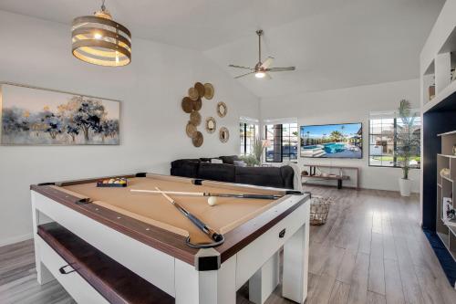 a living room with a pool table at Azure Oasis-Saltwater Pool & Spa with Putting green! in Palm Desert