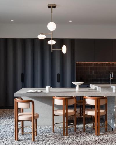 a dining room with a table and chairs at Kasa at The Waller Austin in Austin