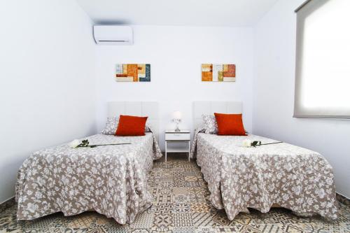 Postel nebo postele na pokoji v ubytování Villa Santorini