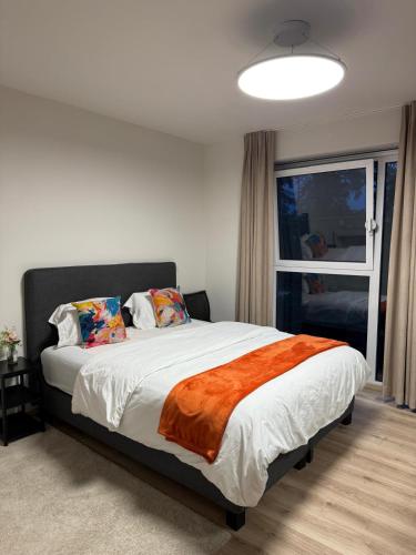 a bedroom with a large bed with a window at Atomium Victory in Brussels