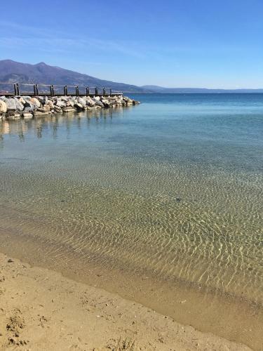 a body of water with a pier in the background at Hotel Karagianni in Volos