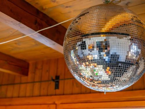 a disco ball is hanging from a ceiling at Chalet H XL in Königsleiten