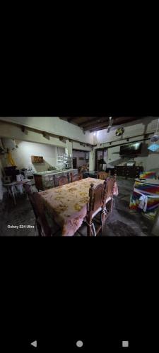 a room with a large bed with chairs in it at Della monica in Tinogasta