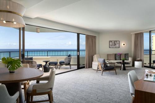 a living room with a view of the ocean at Moana Surfrider, A Westin Resort & Spa, Waikiki Beach in Honolulu