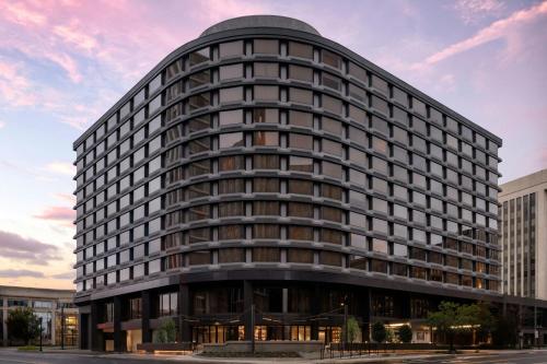 an office building with a round building at AC Hotel Arlington National Landing in Arlington