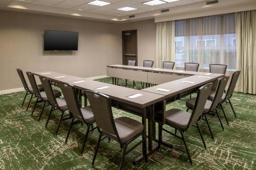 a conference room with a long table and chairs at Residence Inn by Marriott Houston City Place in Spring