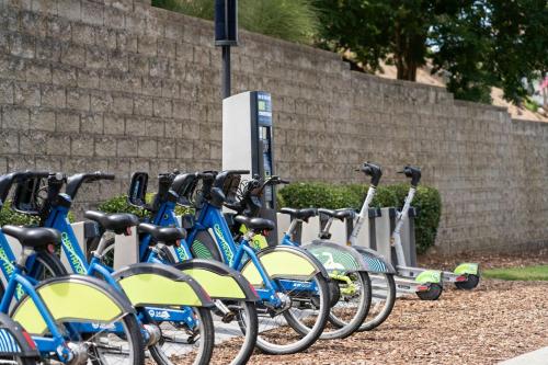 a row of bikes parked next to a brick wall at SpringHill Suites by Marriott Downtown Chattanooga/Cameron Harbor in Chattanooga