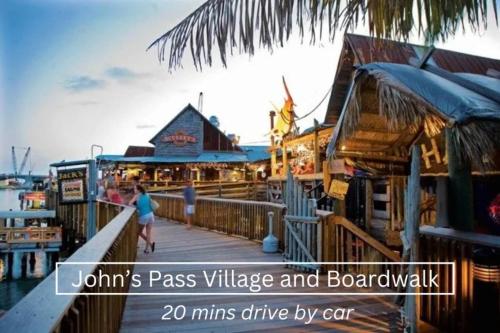 a boardwalk with a restaurant and people walking on it at 7 People 4 Beds - 8 mins to beach by car - 2 mins to downtown - MODERN in Largo