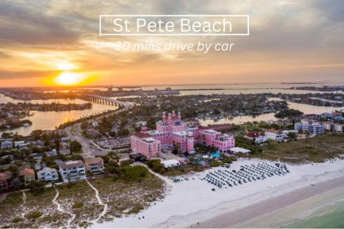 a picture of a beach with the sunset at 7 People 4 Beds - 8 mins to beach by car - 2 mins to downtown - MODERN in Largo