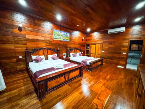 Ένα ή περισσότερα κρεβάτια σε δωμάτιο στο Piseth Private Villa Hotel