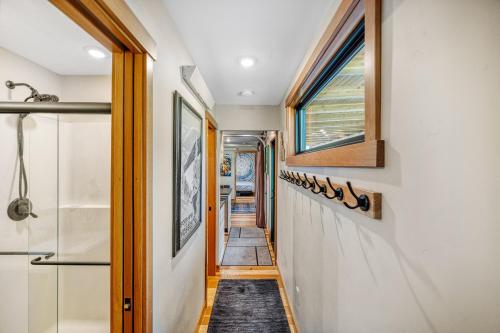 a hallway of a house with a window at Two Pines - Unique container home w/hot tub - Downtown - Trailer Parking - Pet friendly in McCall