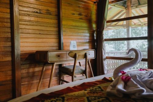Ένα ή περισσότερα κρεβάτια σε δωμάτιο στο Alam Bulangan Villa
