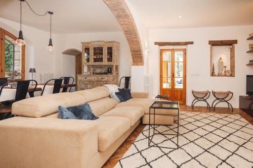 a living room with a couch and a table at Charming Farmhouse in Monteleone D'Orvieto in Monteleone dʼOrvieto
