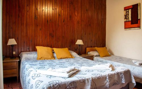 a bedroom with two beds with towels on them at Italia in La Falda