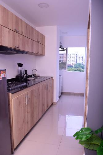 Cucina o angolo cottura di Aparta Suites la Flora Flora-Piscina-Jacuzzi