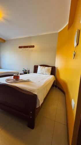 En eller flere senge i et værelse på Alojamiento en habitación