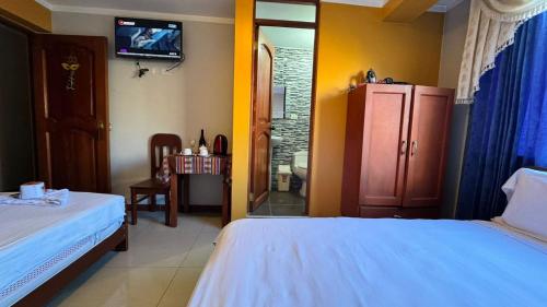 En eller flere senge i et værelse på Alojamiento en habitación