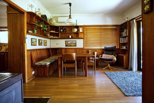 a dining room with a table and chairs at Seabreeze Arches in Callala Bay