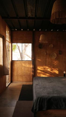 Una cama o camas en una habitación de Los Asentamientos
