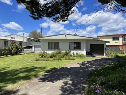a house with a driveway in front of it at Viv's Place in Greenwell Point