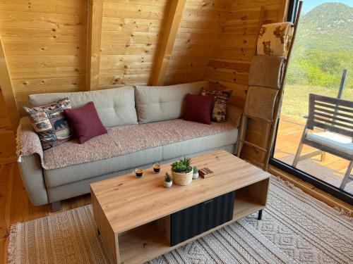 a living room with a couch and a coffee table at BEV's Hideaway 