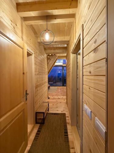 a hallway of a house with wooden walls at BEV's Hideaway 