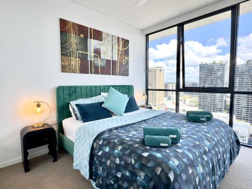 a bedroom with a large bed with a large window at River View Apartment South Brisbane in Brisbane
