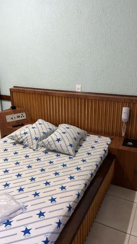 a bedroom with a bed with blue stars on it at Hotel estrela da lapa in Sao Paulo